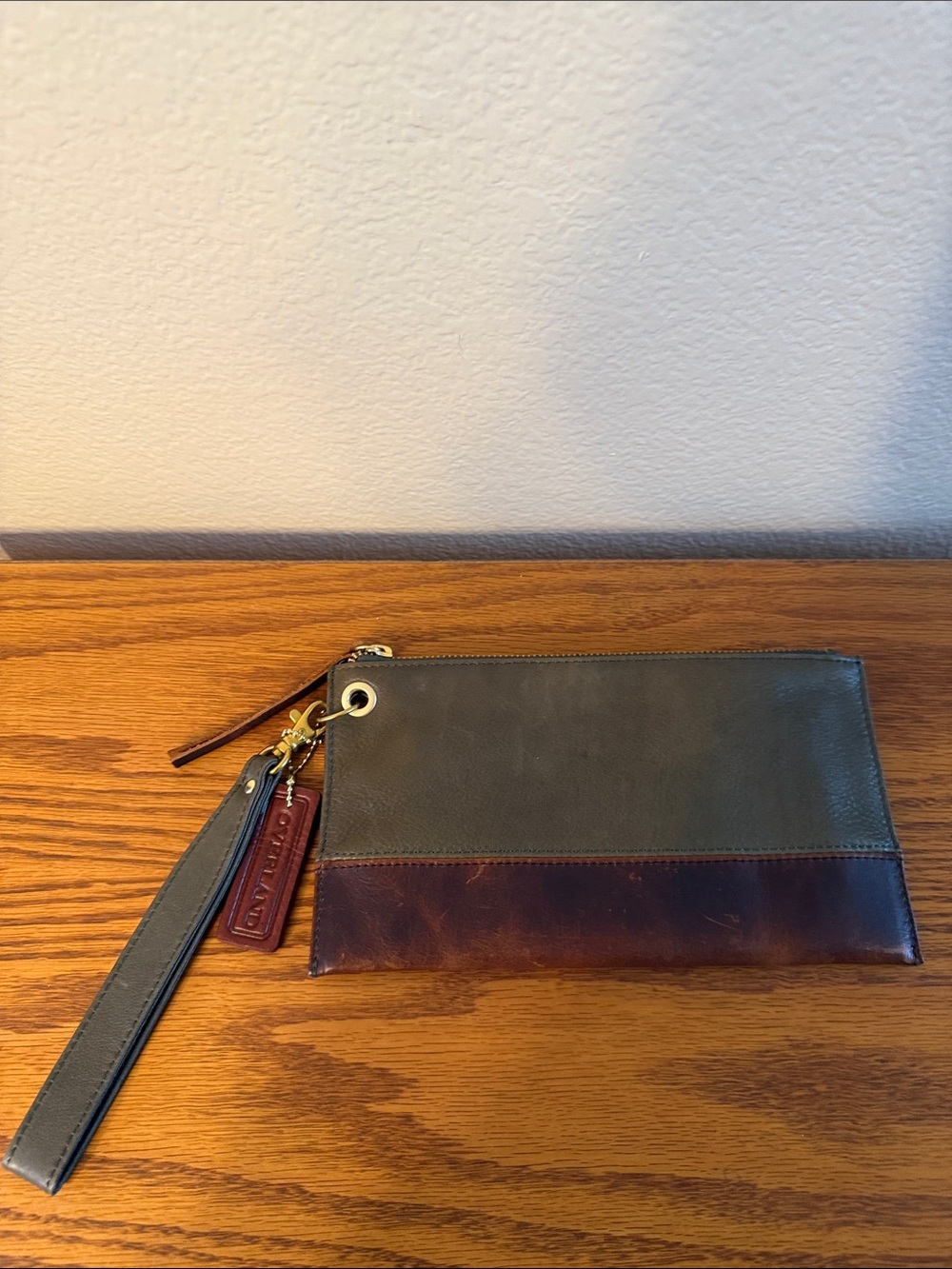 A dual-tone leather accessory from the brand Overland